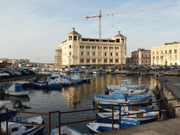 The Old Post Office at the Riva della Posta square and boats in the harbour, viewed from the Ponte Umbertino bridge