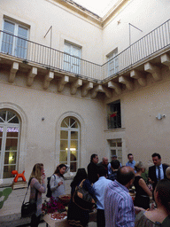 Course participants at the Wine and Cheese event at the Inner Square of the Impact Hub building at the Via Vincenzo Mirabella street