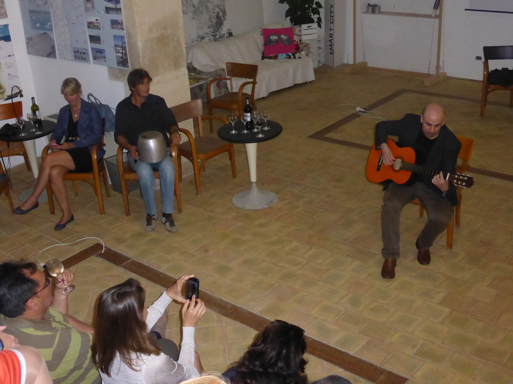 Course participants making music at the Wine and Cheese event in the Impact Hub building at the Via Vincenzo Mirabella street