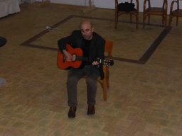 Course participant making music at the Wine and Cheese event in the Impact Hub building at the Via Vincenzo Mirabella street