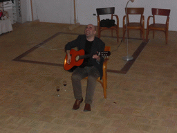 Course participant making music at the Wine and Cheese event in the Impact Hub building at the Via Vincenzo Mirabella street