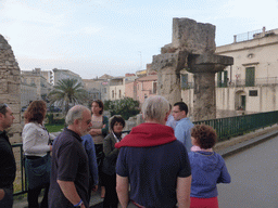Course participants and the tour guide at the Temple of Apollo at the Largo XXV Luglio square