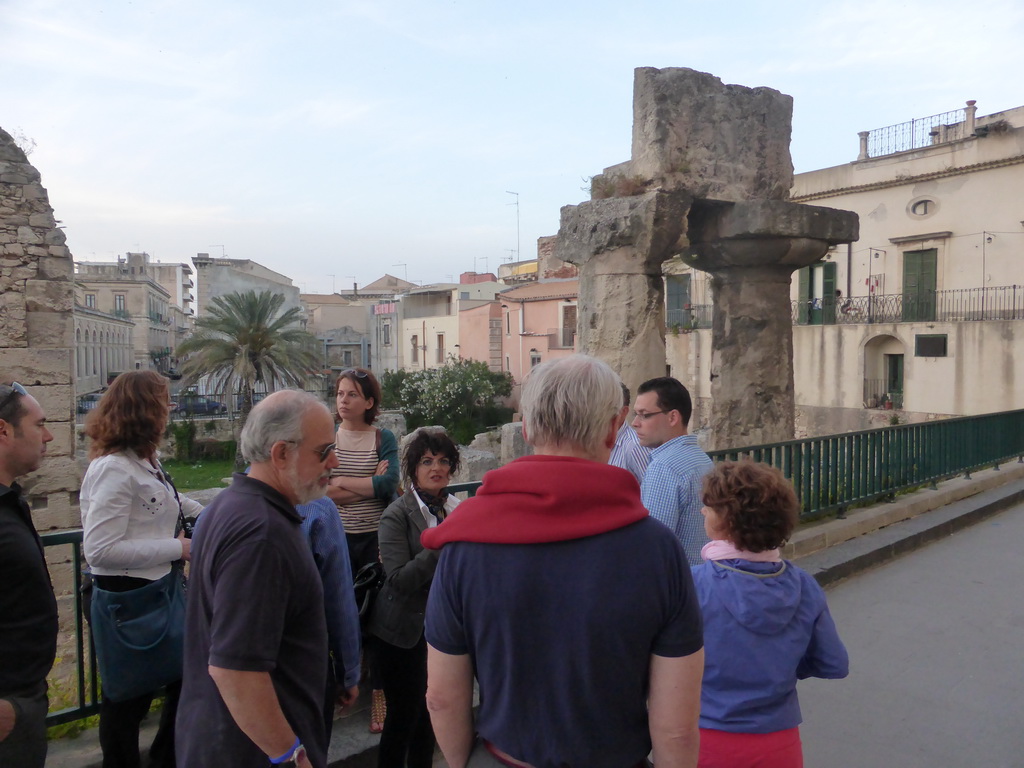 Course participants and the tour guide at the Temple of Apollo at the Largo XXV Luglio square