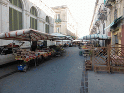 Market stalls with food at the Via Emanuele de Benedictis street