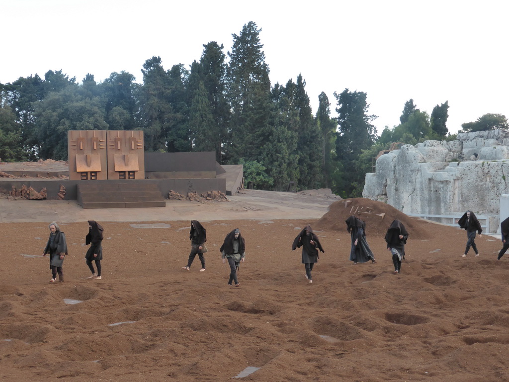 Chorus and the gates of Argos at the stage of the Greek Theatre at the Parco Archeologico della Neapolis park, during the play `Agamemnon` by Aeschylus