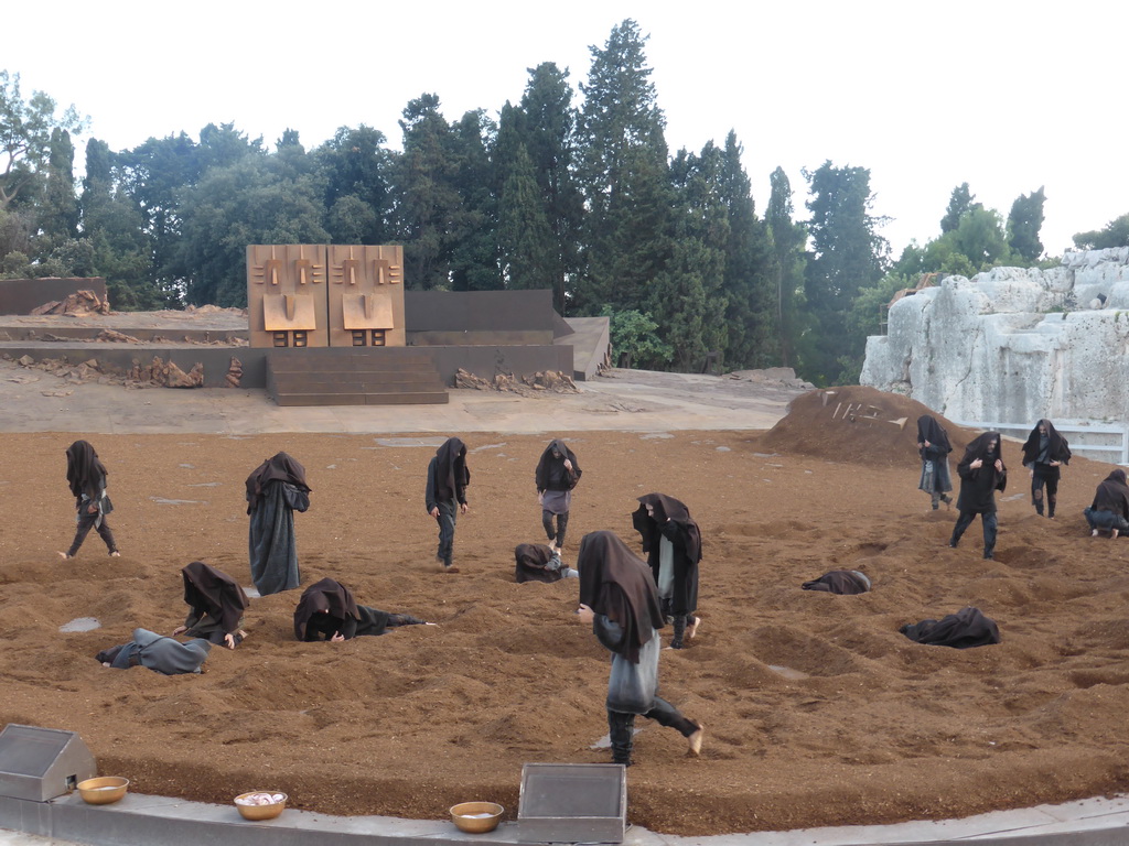 Chorus and the gates of Argos at the stage of the Greek Theatre at the Parco Archeologico della Neapolis park, during the play `Agamemnon` by Aeschylus