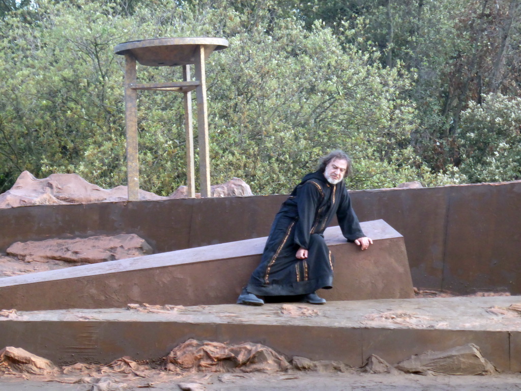 Watchman and torch at the stage of the Greek Theatre at the Parco Archeologico della Neapolis park, during the play `Agamemnon` by Aeschylus