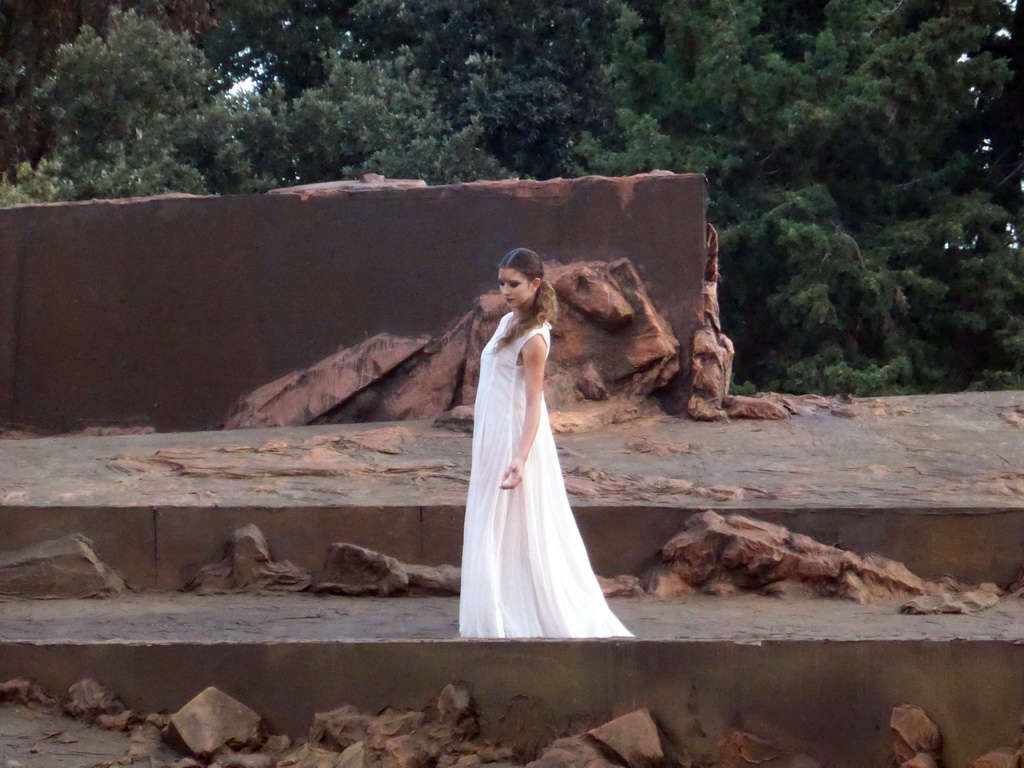 Female dancer at the stage of the Greek Theatre at the Parco Archeologico della Neapolis park, during the play `Agamemnon` by Aeschylus