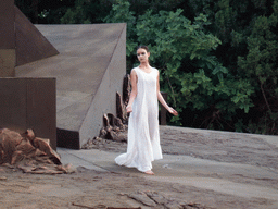 Female dancer at the stage of the Greek Theatre at the Parco Archeologico della Neapolis park, during the play `Agamemnon` by Aeschylus