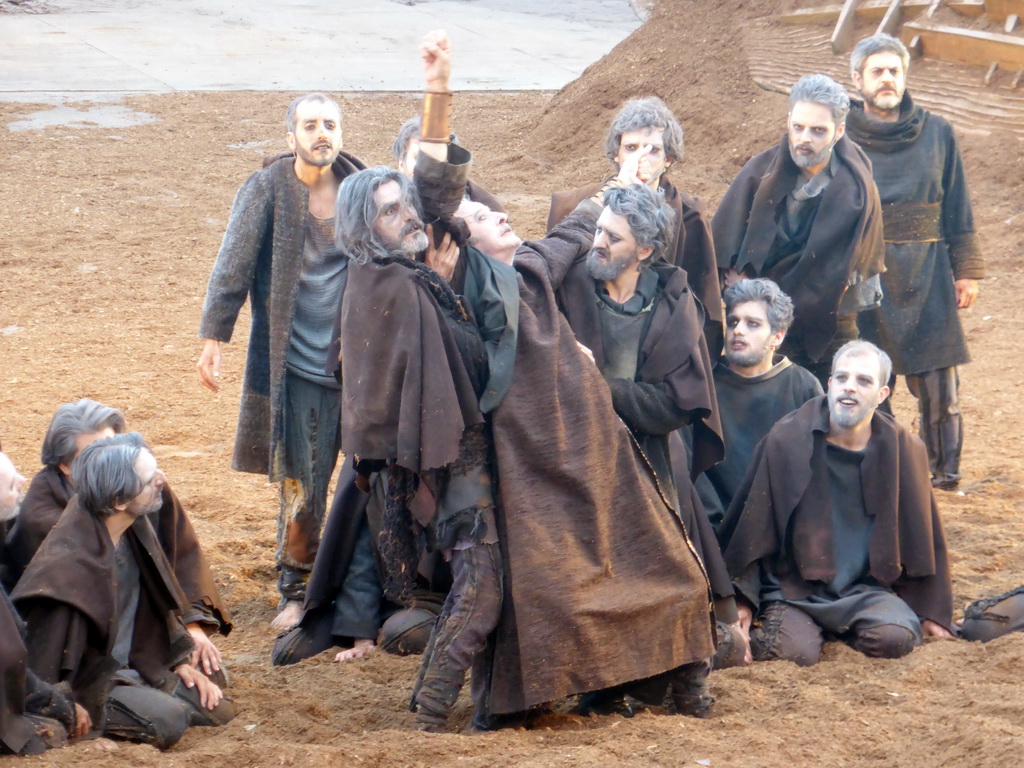 Chorus at the stage of the Greek Theatre at the Parco Archeologico della Neapolis park, during the play `Agamemnon` by Aeschylus