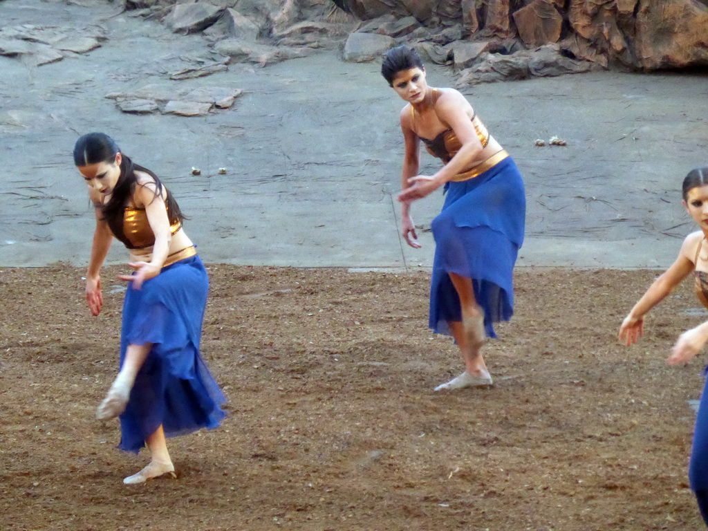 Female dancers at the stage of the Greek Theatre at the Parco Archeologico della Neapolis park, during the play `Agamemnon` by Aeschylus