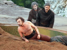 Agamemnon in a boat and the chorus at the stage of the Greek Theatre at the Parco Archeologico della Neapolis park, during the play `Agamemnon` by Aeschylus