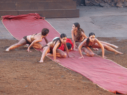 Female dancers with the purple tapestry to the gates of Argos at the stage of the Greek Theatre at the Parco Archeologico della Neapolis park, during the play `Agamemnon` by Aeschylus