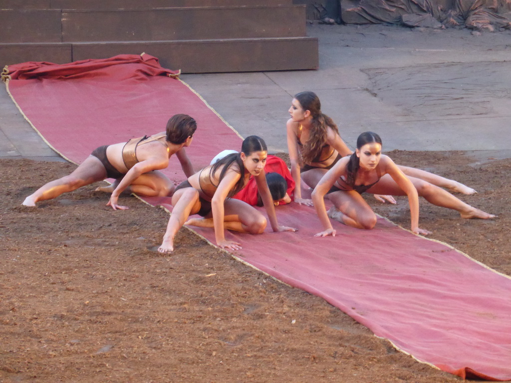 Female dancers with the purple tapestry to the gates of Argos at the stage of the Greek Theatre at the Parco Archeologico della Neapolis park, during the play `Agamemnon` by Aeschylus