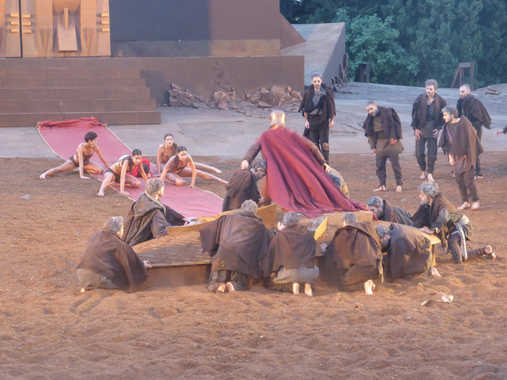 Chorus, boat, female dancers and Agamemnon walking over the purple tapestry to the gates of Argos at the stage of the Greek Theatre at the Parco Archeologico della Neapolis park, during the play `Agamemnon` by Aeschylus185