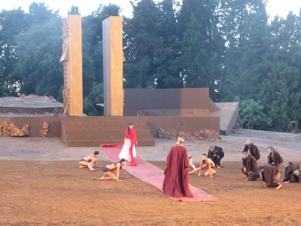 Chorus, female dancers and Agamemnon walking over the purple tapestry to the gates of Argos at the stage of the Greek Theatre at the Parco Archeologico della Neapolis park, during the play `Agamemnon` by Aeschylus185