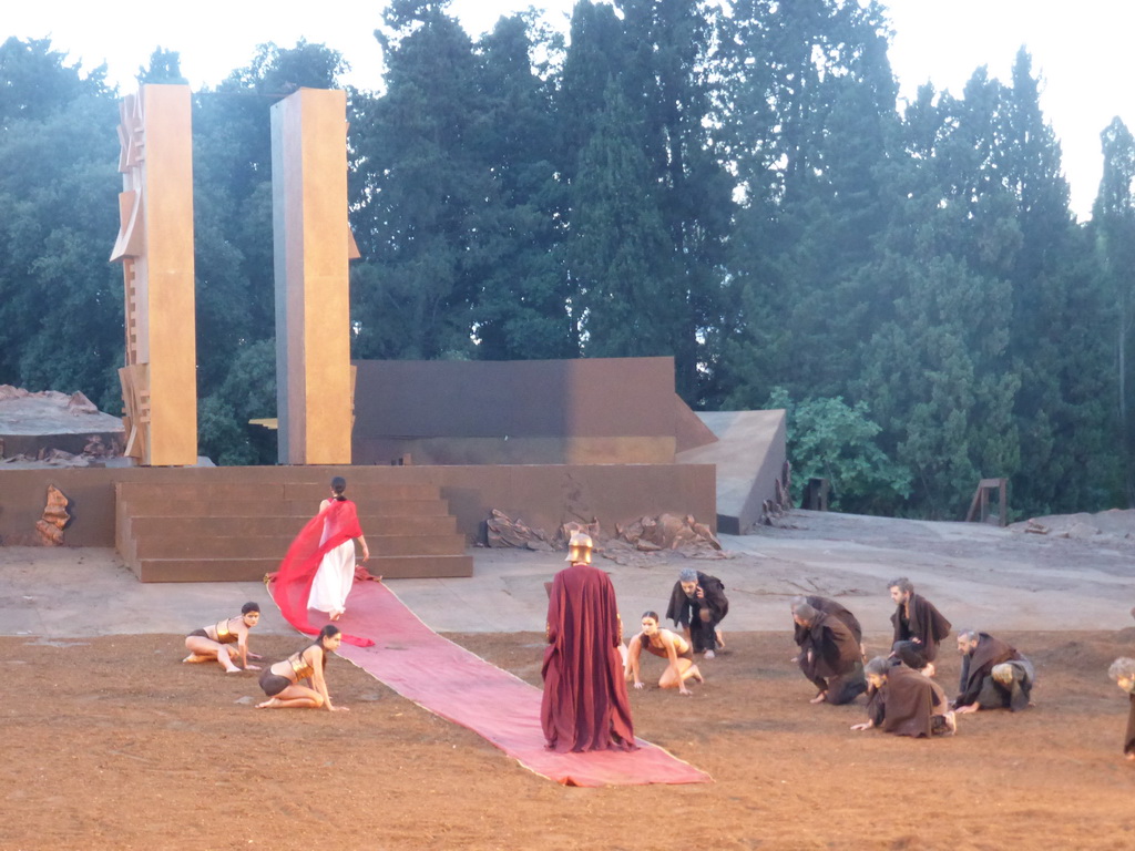 Chorus, female dancers and Agamemnon walking over the purple tapestry to the gates of Argos at the stage of the Greek Theatre at the Parco Archeologico della Neapolis park, during the play `Agamemnon` by Aeschylus185