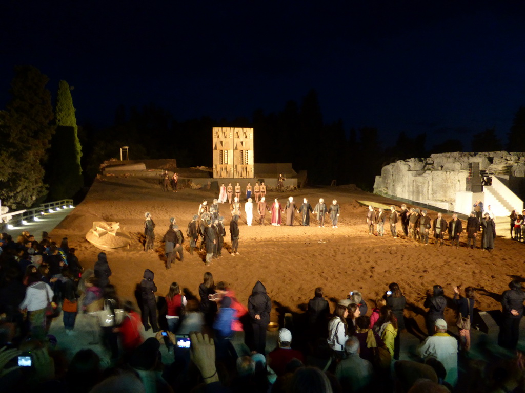 Actors receiving applause at the stage of the Greek Theatre at the Parco Archeologico della Neapolis park, at the end of the play `Agamemnon` by Aeschylus