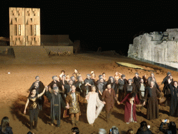 Actors receiving applause at the stage of the Greek Theatre at the Parco Archeologico della Neapolis park, at the end of the play `Agamemnon` by Aeschylus