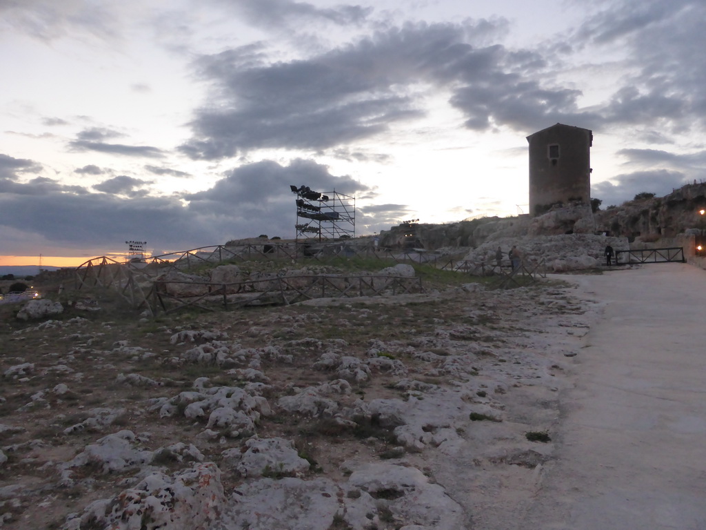 Back side of the Greek Theatre at the Parco Archeologico della Neapolis park, at sunset