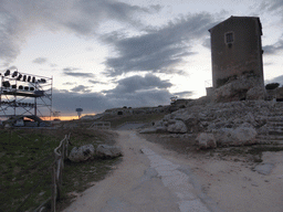 Back side of the Greek Theatre with the Nymphaeum at the Parco Archeologico della Neapolis park, at sunset