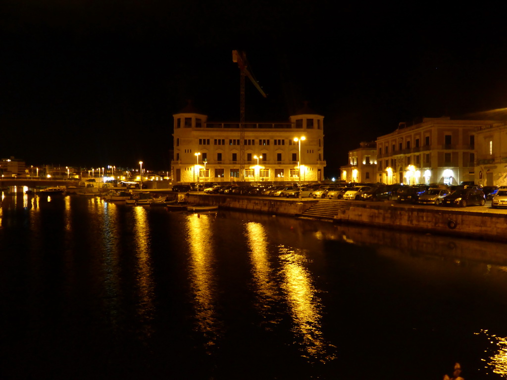 The harbour north of the Ponte Umbertino bridge and the Old Post Office, viewed from the Ponte Umbertino bridge, by night