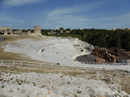 The Greek Theatre at the Parco Archeologico della Neapolis park, with the stage being prepared for the play `The Wasps` by Aristophanes, and the Santuario della Madonna delle Lacrime church, viewed from the Nymphaeum