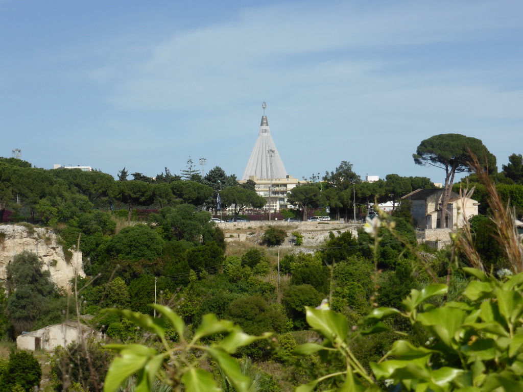 The Latomia del Paradiso quarry and the Chiesa San Nicolò ai Cordari church at the Parco Archeologico della Neapolis park and the Santuario della Madonna delle Lacrime church, viewed from the back side of the Greek Theatre