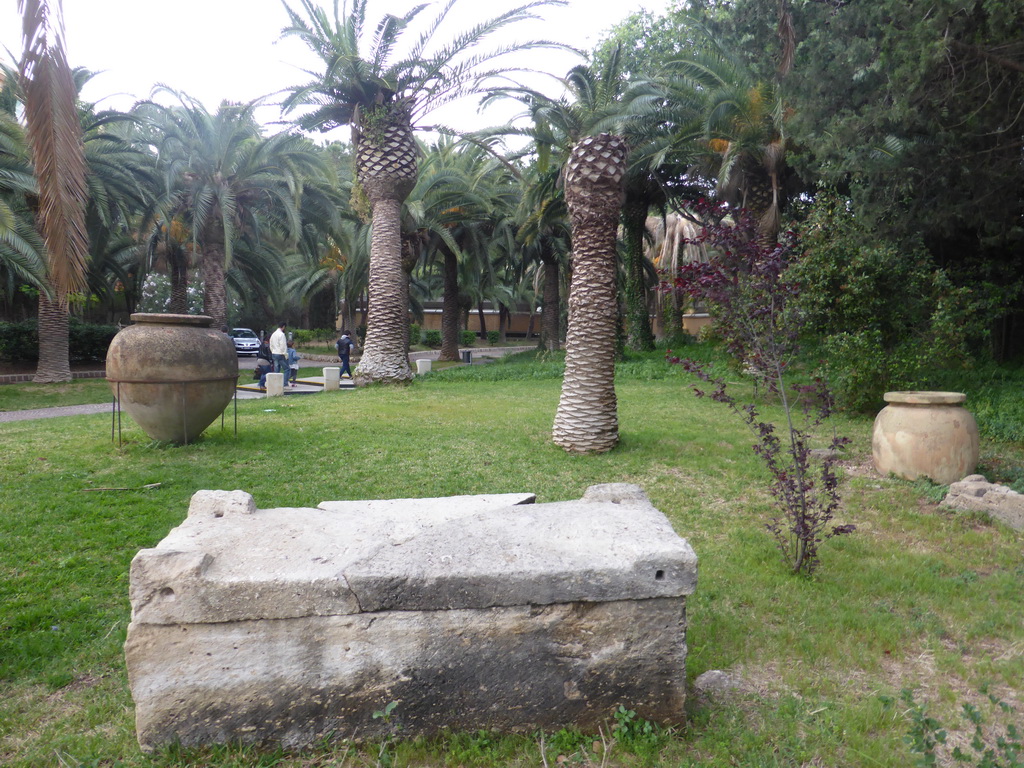Jars and stones at the Villa Landolina Gardens in front of the Paolo Orsi Archaeological Museum