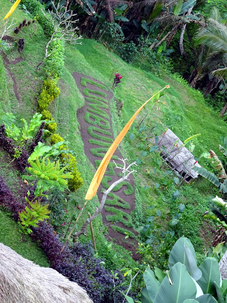 Text `Lumbung Sari` at the north part of the Tegalalang rice terraces, viewed from the Lumbing Sari Warung café