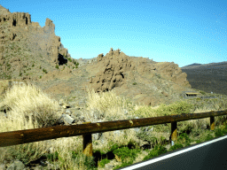 Rocks and the front of the Ethnographic Museum Juan Évora, viewed from the rental car on the TF-21 road on the southwest side of the Teide National Park