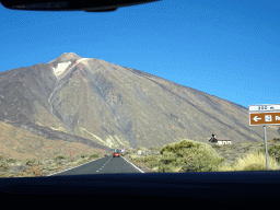 Mount Teide, the TF-21 road and the Ermita de las Nieves church on the south side of the Teide National Park, viewed from the rental car
