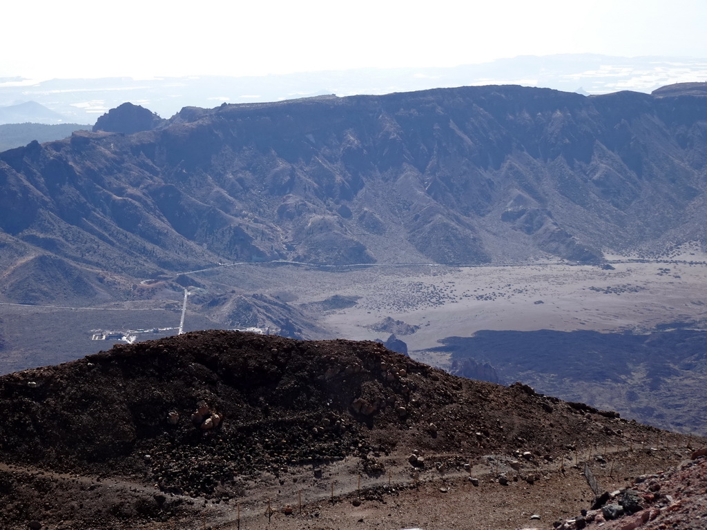 The south side of the Cañadas del Teide crater with the TF-21 road, the Roques de García rocks and the Ermita de las Nieves church, viewed from the La Rambleta viewpoint