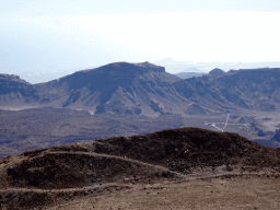 The south side of the Cañadas del Teide crater with the TF-21 road, the Roques de García rocks and the Ermita de las Nieves church, viewed from the La Rambleta viewpoint