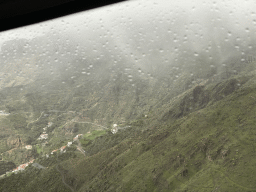 Hills and houses on the east side of the town, viewed from the tour bus on the GC-15 road