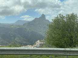 The Roque Bentayga rock and the north side of the town, viewed from the tour bus on the GC-15 road