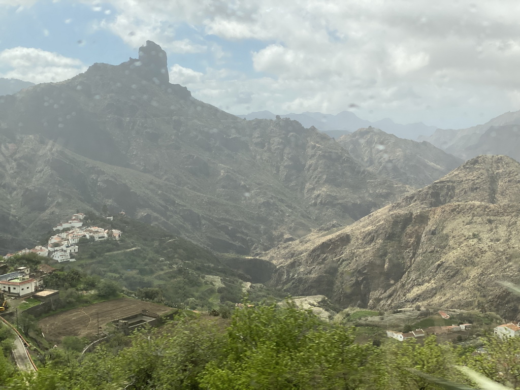 The Roque Bentayga rock and the north side of the town, viewed from the tour bus on the GC-60 road