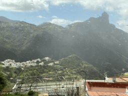 The Roque Bentayga rock and the north side of the town, viewed from the tour bus on the GC-60 road