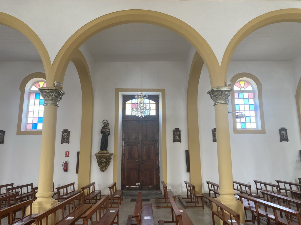 Door and stained glass windows at the left aisle of the Parroquia de Nuestra Señora del Socorro church