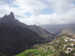 The Roque Bentayga rock and the west side of the town, viewed from the parking lot at the Calle Dr. Domingo Hernández Guerra street