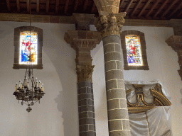 Stained glass windows and chandeleer at the left aisle of the Basílica de Nuestra Señora del Pino church