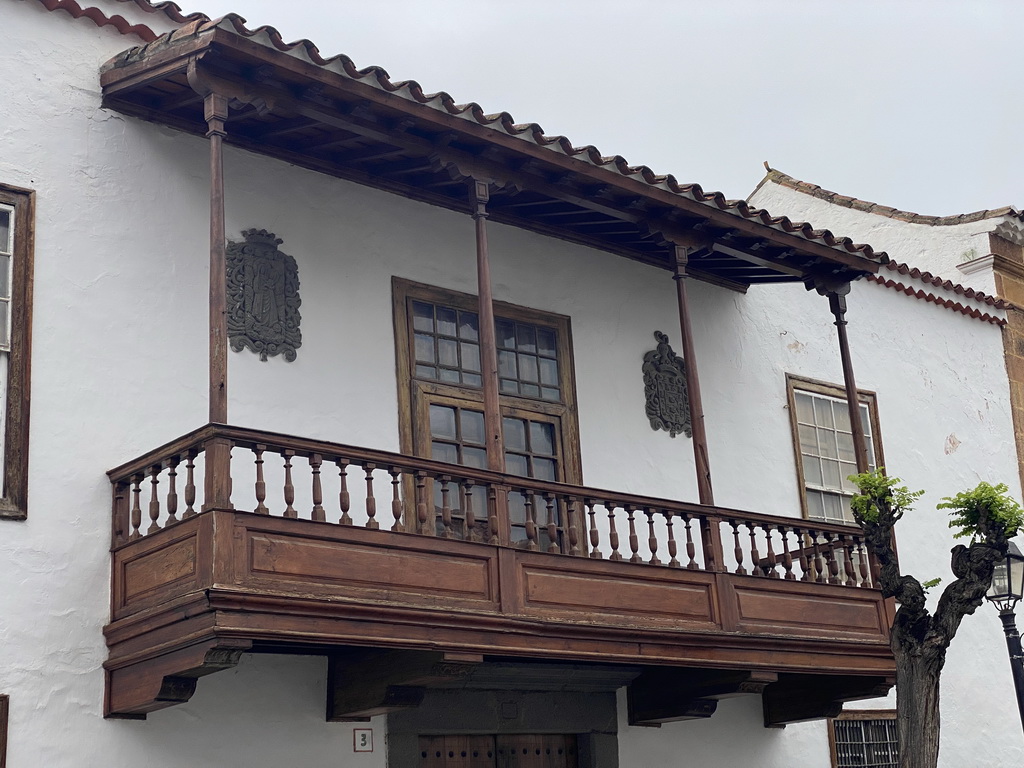 Wooden balcony of a house at the Calle Real de la Plaza street