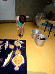 Max playing a fishing game at the Sea Aquarium at the Ecomare seal sanctuary at De Koog