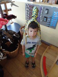 Max with an Octopus toy at the souvenir shop at the Ecomare seal sanctuary at De Koog