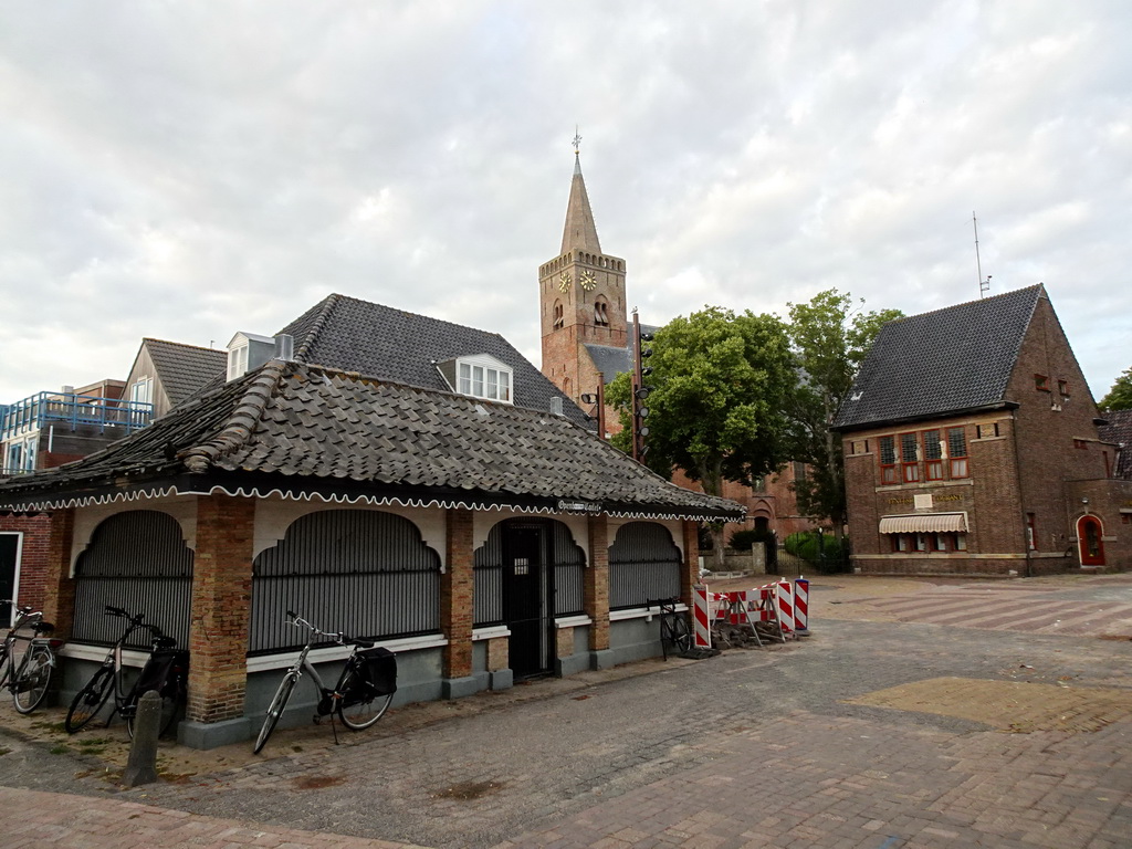 The Texelse Courant building and the Burghtkerk church at the Vismarkt square at Den Burg