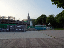 Buildings under construction and the Burghtkerk church at the Groeneplaats square at Den Burg, at sunset