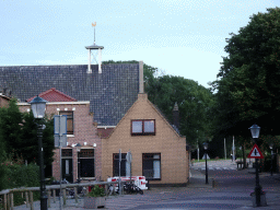 The De Poort church at the Elemert street at Den Burg, viewed from the Groeneplaats square, at sunset