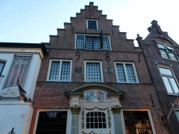 Facade of the Drank & Spijslokaal Het Schoutenhuys restaurant at the Vismarkt square at Den Burg, at sunset