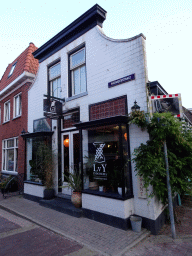 Front of the LvY Indonesia by Anneke`s Kitchen restaurant at the Warmoesstraat street at Den Burg, at sunset