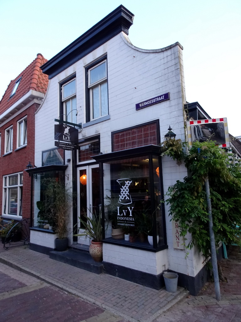 Front of the LvY Indonesia by Anneke`s Kitchen restaurant at the Warmoesstraat street at Den Burg, at sunset